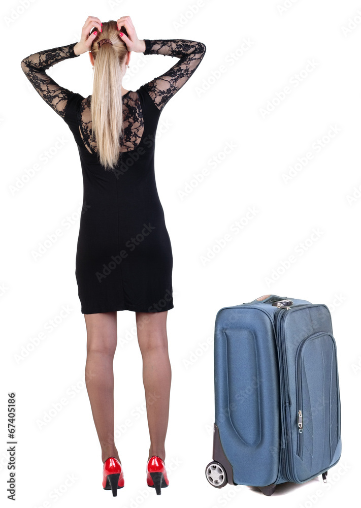 Back view of shocked business woman in dress traveling with suit Back view of shocked business woman in dress traveling with suit
