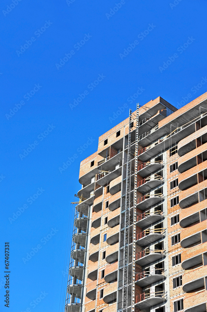 Building construction site work against blue sky Building construction site work against blue sky