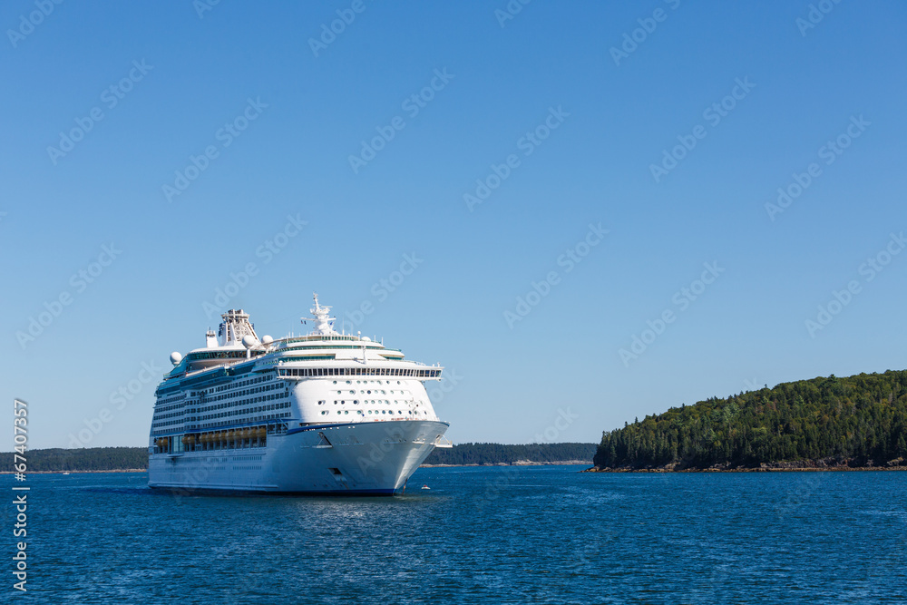 White Cruise Ship Between Blue Sea and Blue Sky