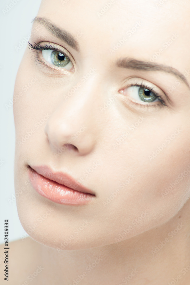 Closeup portrait of young beautiful green eyed woman