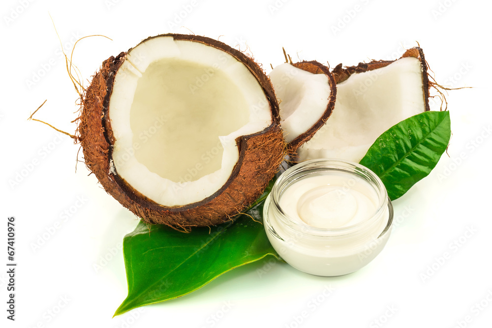Coconut cocos with cream and green leaves