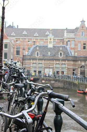 Bicycles on the background of Amsterdam canals.