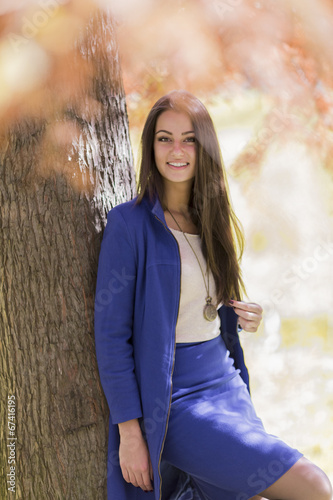 Young woman in autumn forest