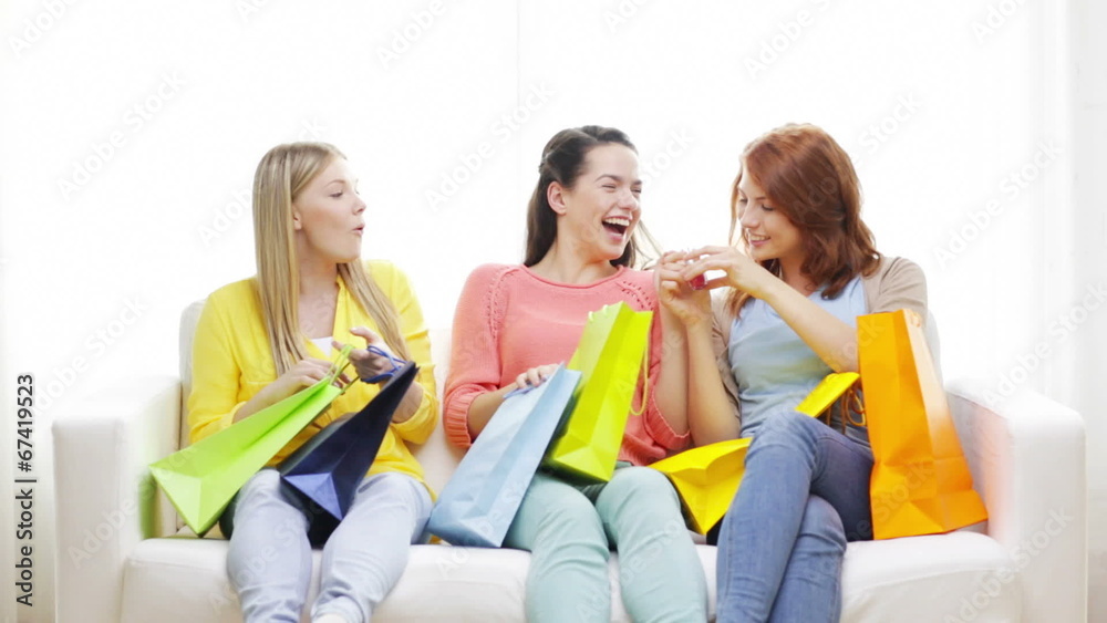 smiling teenage girls with many shopping bags smiling teenage girls with many shopping bags
