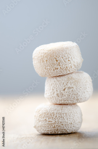 French fresh goat cheese on a wood desk