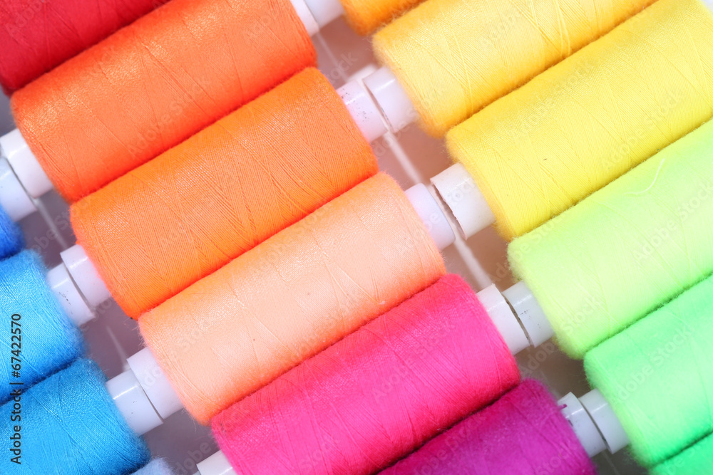 Multicolor sewing threads background Multicolor sewing threads background