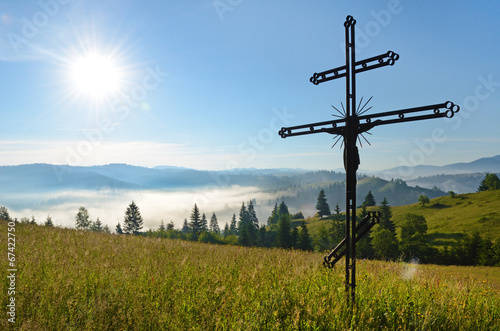 Crucifixion of Jesus Christ in the midst of meadows in Carpathia