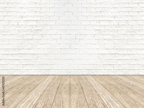 empty brick room wall and wood plank floor