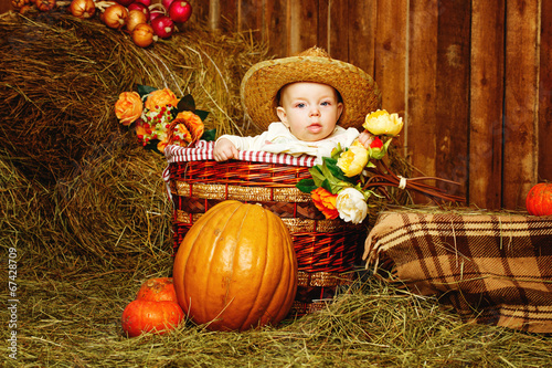 Girl and harvest pumpkins photo