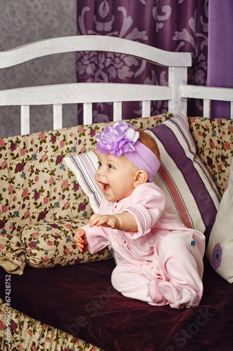 Little girl sitting on couch