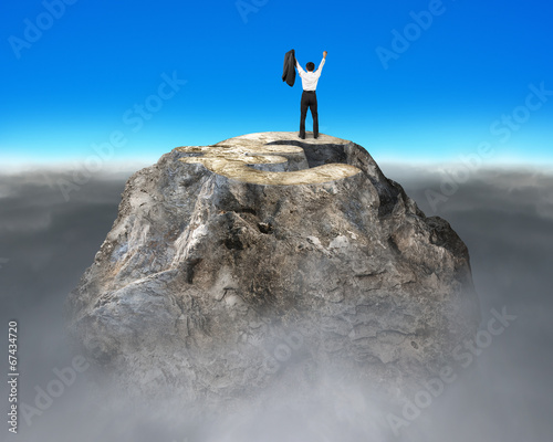 Cheering on top of money symbol rocky mountain