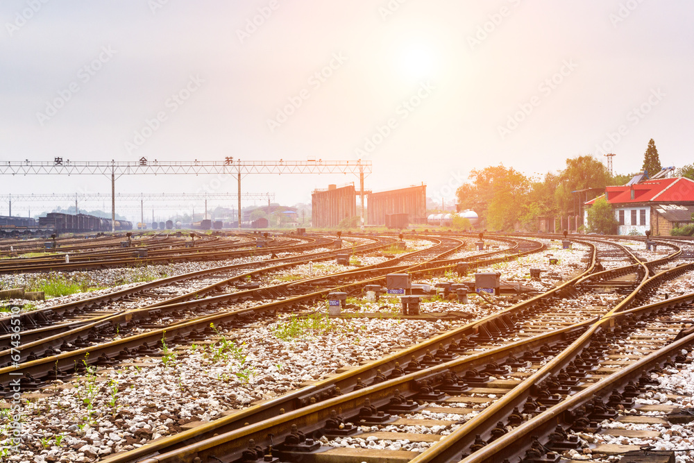 Cargo train platform at sunset with container