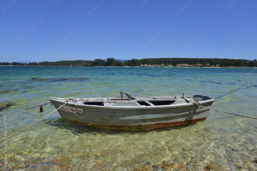 wooden colored boats in the beach sand