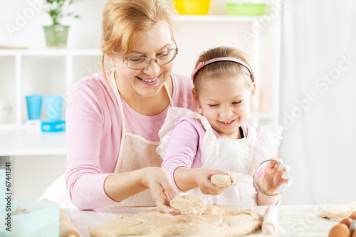 Grandmother and granddaughter making Dough