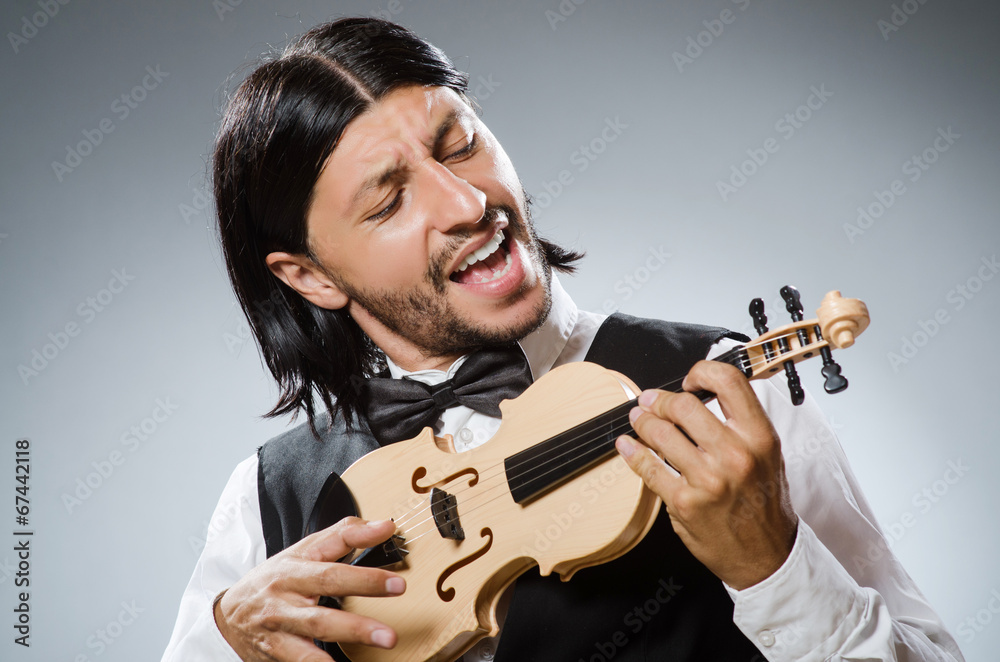 Funny fiddle violin player in musical concept Funny fiddle violin player in musical concept