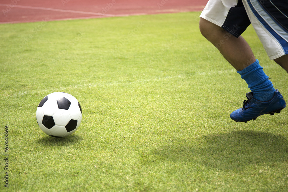 soccer player running with ball