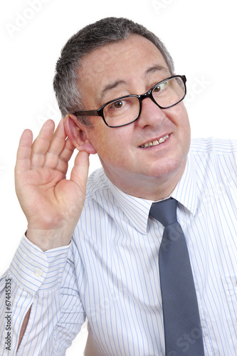 Man holding his ear to hear better