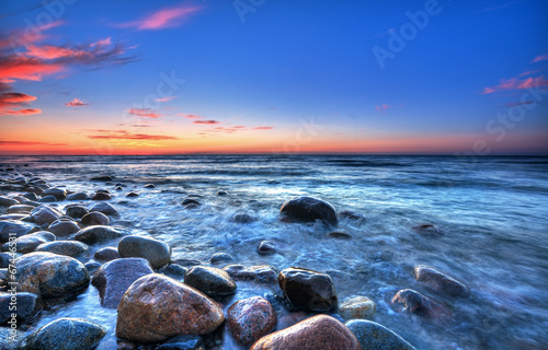 Sunset over the Baltic sea. The pebbly beach in Rozewie #67446531