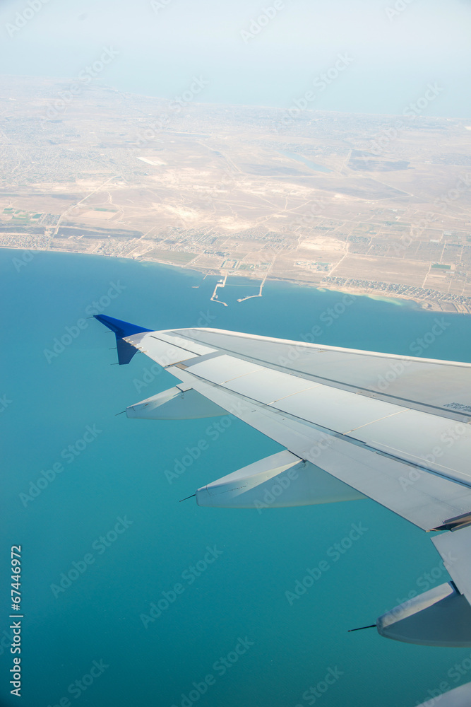 Fototapeta premium Airplane wing out of window