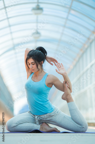 Woman doing stretching yoga exercises