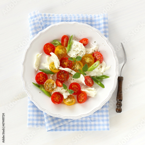 Mozzarella with red and yellow cherry tomatoes