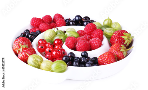 Forest berries on plate  isolated on white