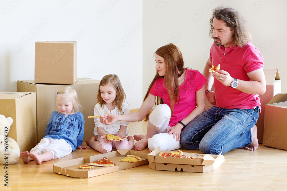 Happy young family in their new home Happy young family in their new home