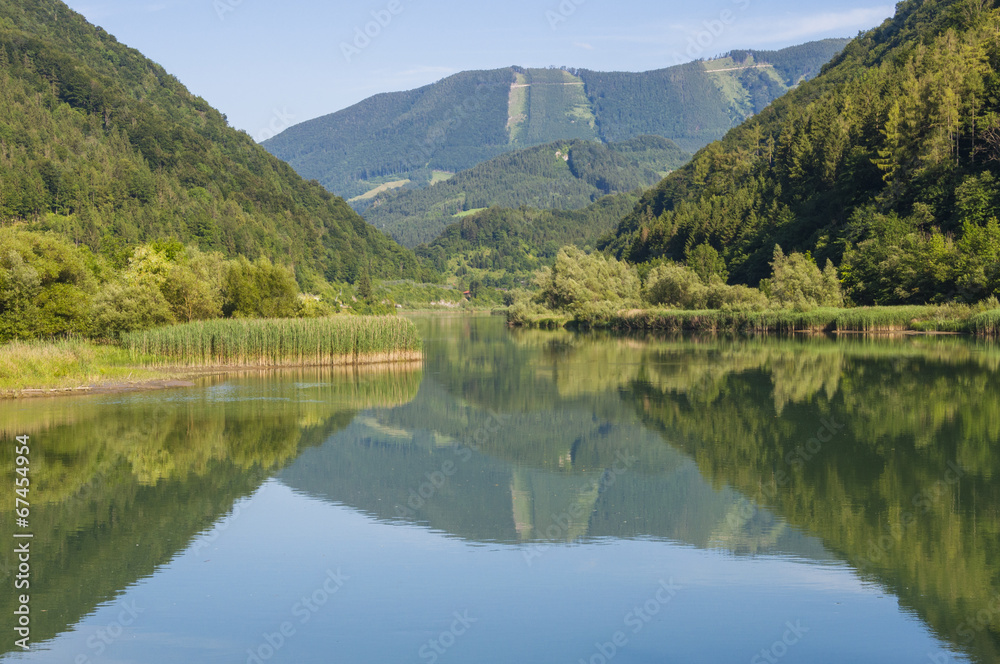 Mountain reflection in the Enns river in Upper Austria