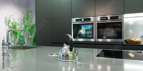 Quadro su tela detail over work plate of modern kitchen with teapot