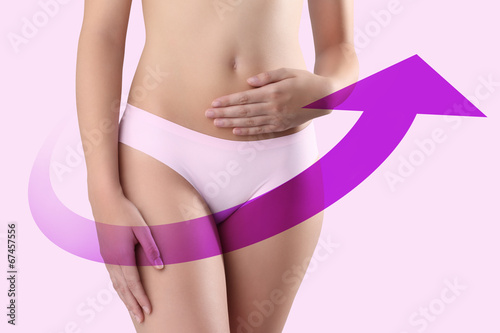woman hands on belly with violet arrow photo