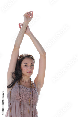 Woman with arms above her head