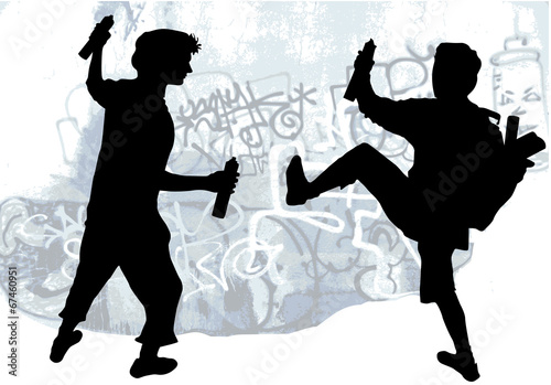 Silhouettes of taggers drawing graffiti