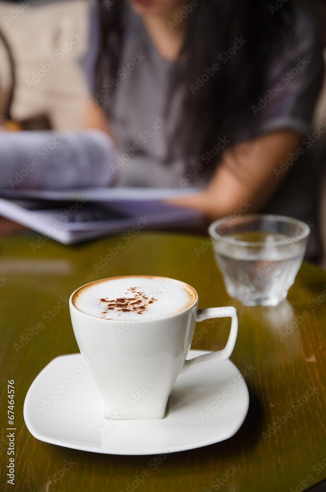 cup of cappuccino on table cup of cappuccino on table