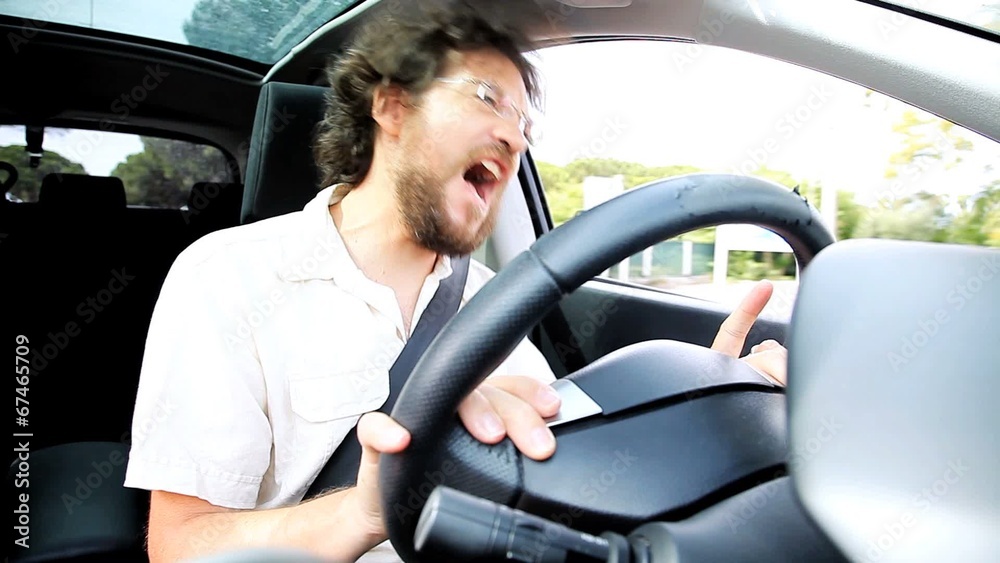 Man singing while driving car Man singing while driving car