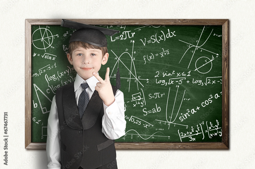 boy near blackboard with formulas