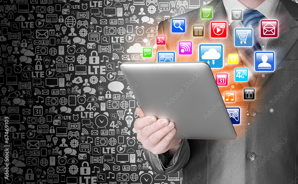 Business man use tablet pc with colorful application icons Business man use tablet pc with colorful application icons