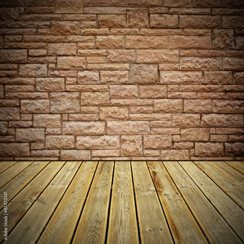 Wooden deck floor and stone bricks wall © -Marcus-