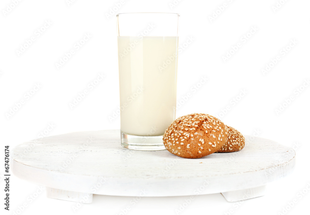 Milk and cookies on wooden tray isolated on white Milk and cookies on wooden tray isolated on white