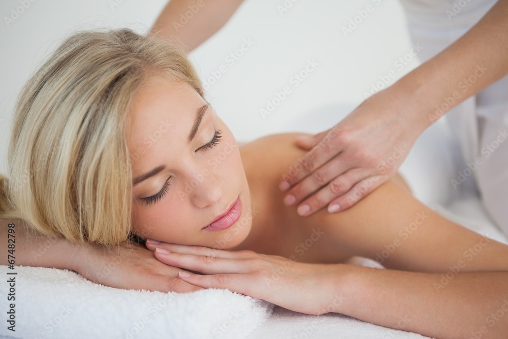 Pretty blonde enjoying a massage