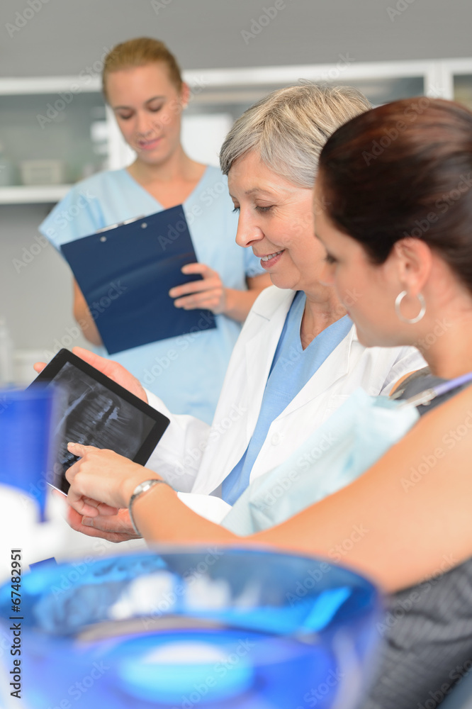Dentist patient point xray tablet dental surgery Dentist patient point xray tablet dental surgery