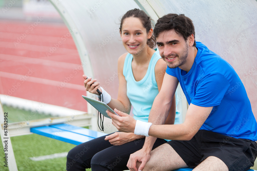 Obraz premium Sport coach training a young attractive woman