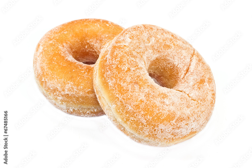 Two donuts powdered with sugar isolated on white Two donuts powdered with sugar isolated on white