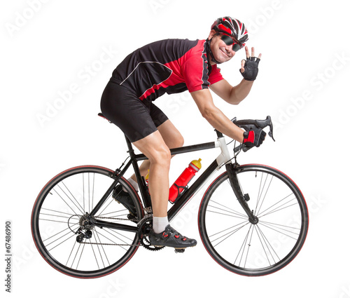 Fototapeta Naklejka Na Ścianę i Meble -  cheerful cyclist with winning gesture riding a bike