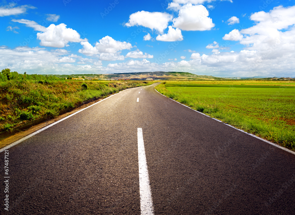 Concept of straight path to success. Asphalt road over blue sky Concept of straight path to success. Asphalt road over blue sky