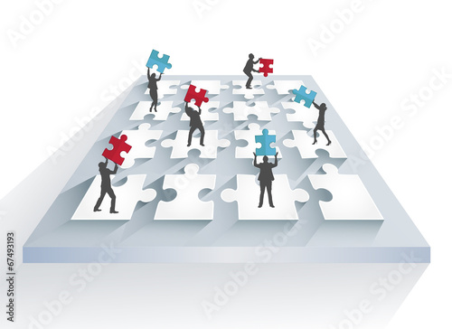 Business people solving jigsaw puzzle together