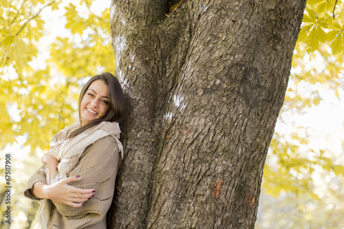 Young woman at autumn forest
