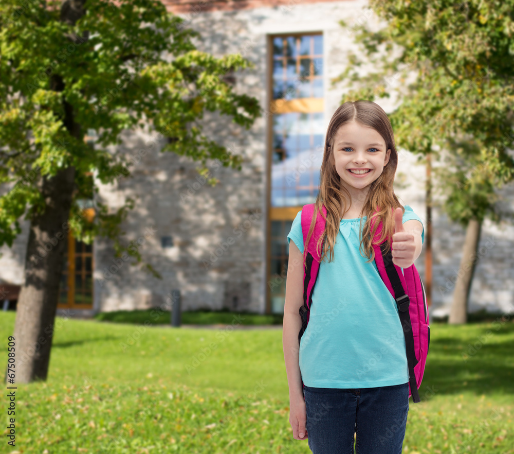 smiling girl with school bag showing thumbs up smiling girl with school bag showing thumbs up