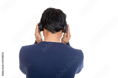 Back of asian man with listen to music with headphone