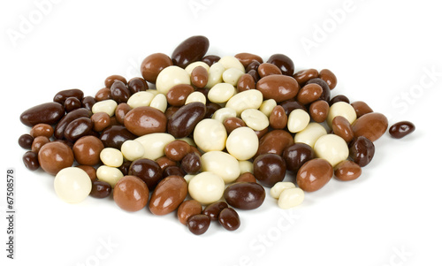 chocolate covered nuts and raisins isolated on white