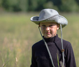 Portrait of a boy in a cowboy hat